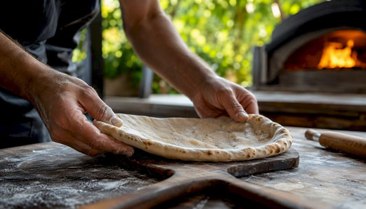 Hands par baking pizza crust on peel