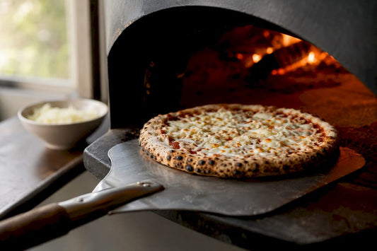 Pizza topped with provolone cheese browning in home oven