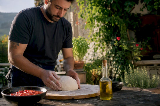 Hands stretching fresh pizza dough on wooden board
