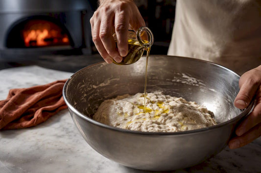 Olive oil added to hydrated pizza dough